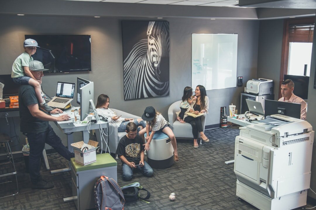 Team of journalists working together in a modern newsroom
