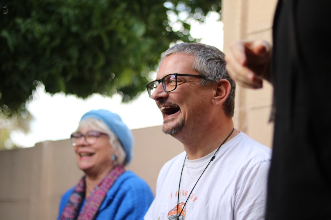 man with friends laughing